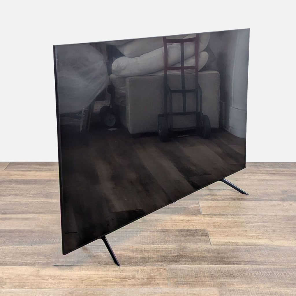 65-inch Samsung TV angled view, brand new condition.
