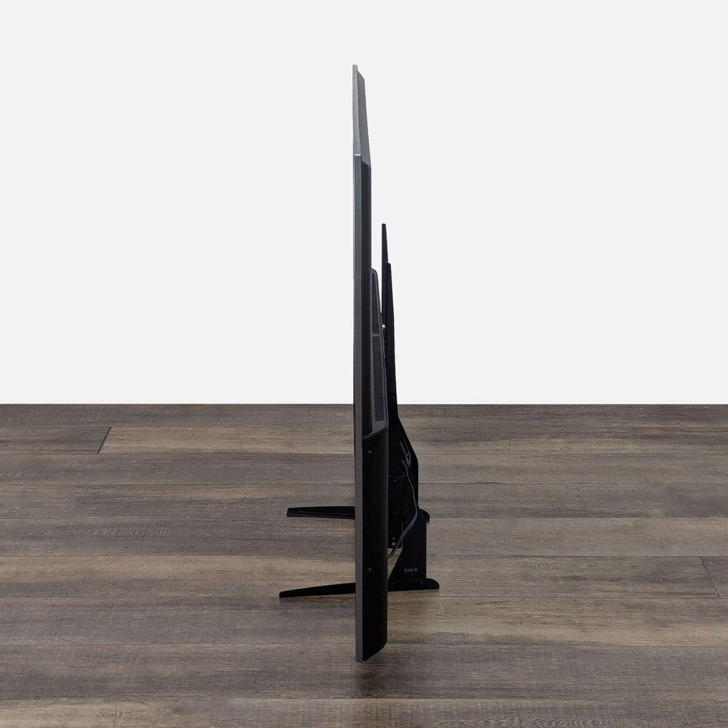 JVC TV viewed from the side, highlighting its minimal thickness.