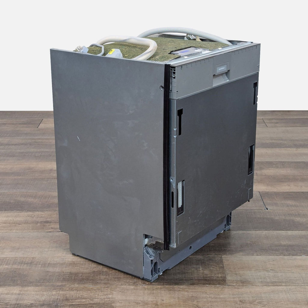 Gaggenau dishwasher in sleek design on wooden floor.