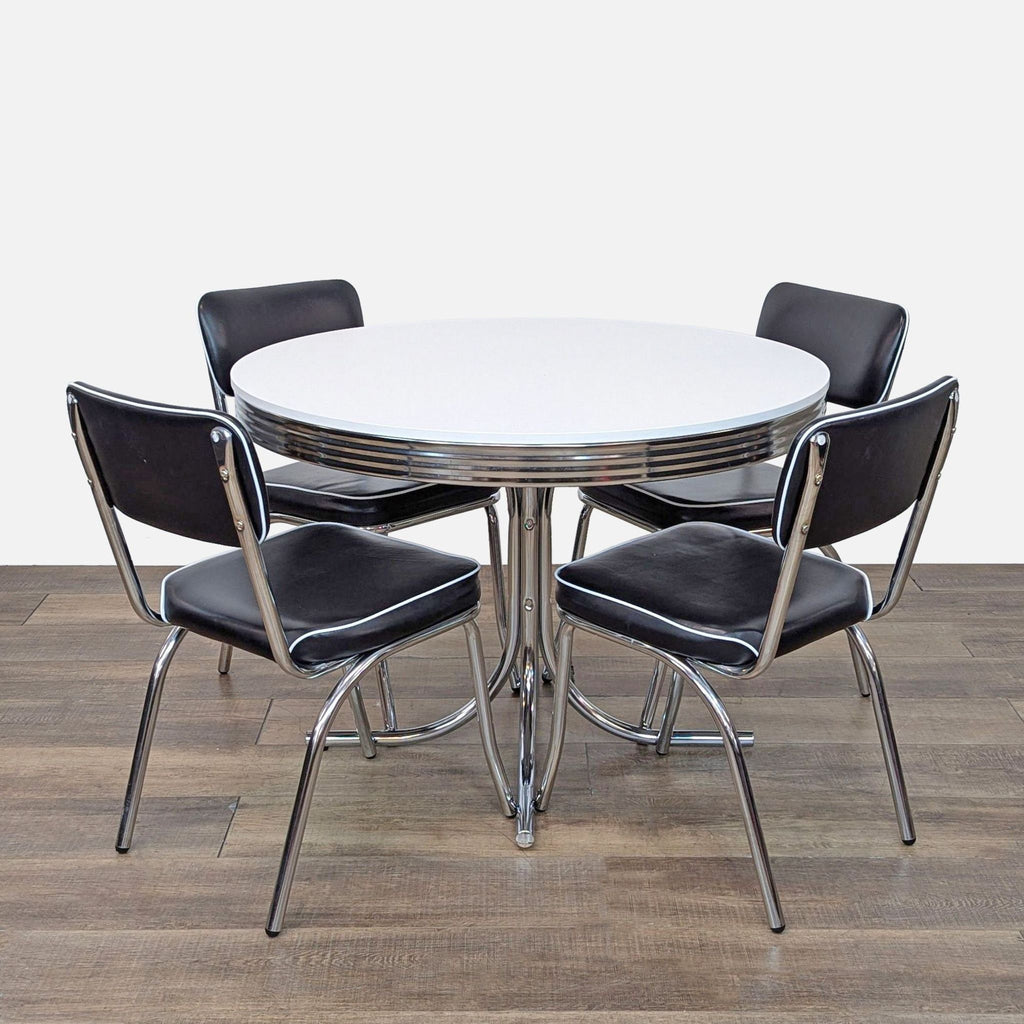 Retro round dining set with black pleather chairs and metal accents.