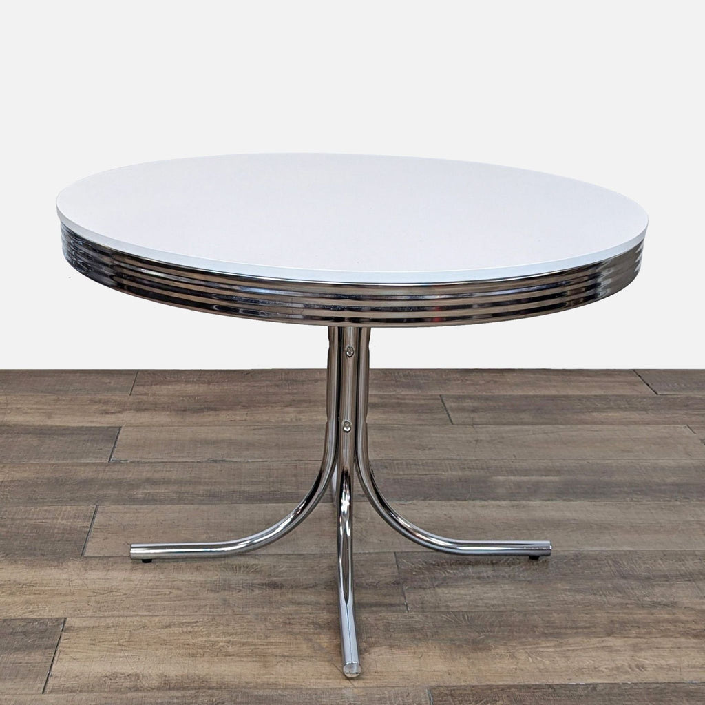 Dining table with a shiny top and flared metal base.