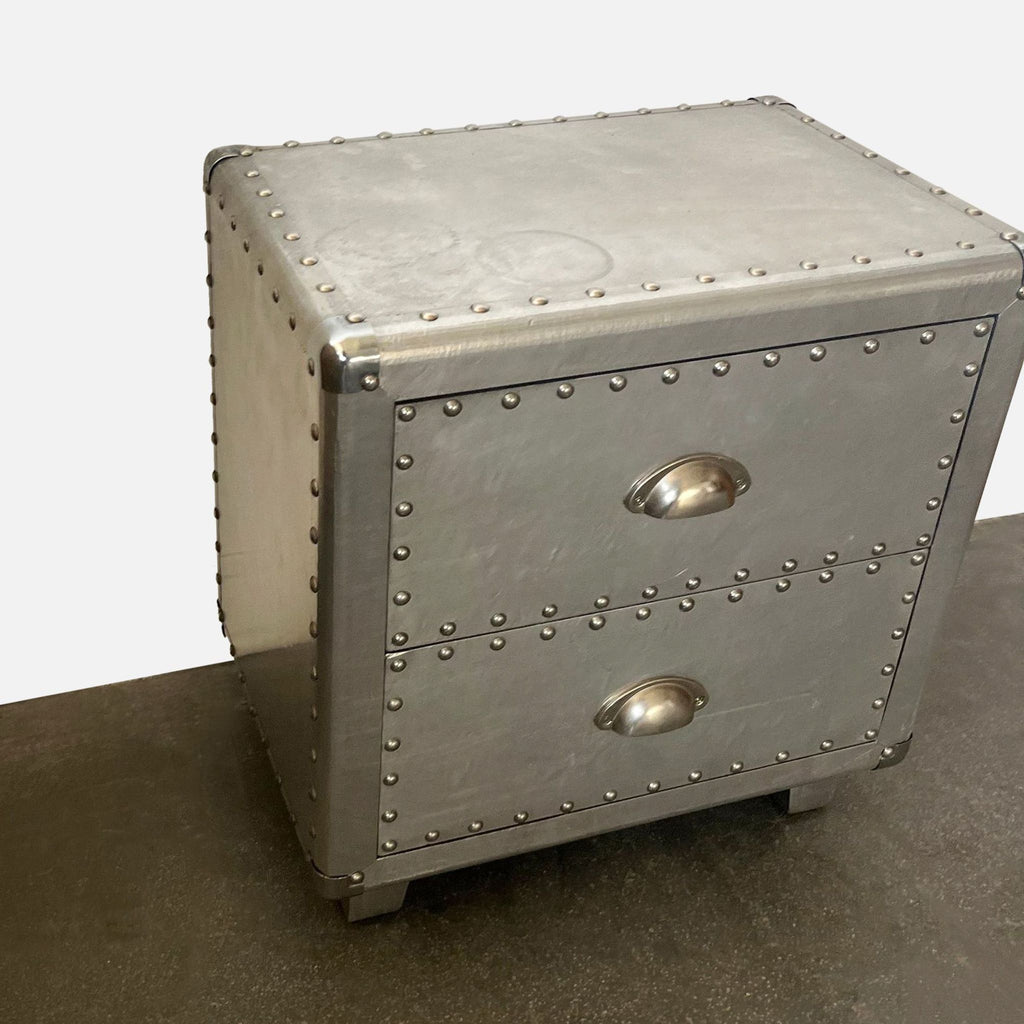 Industrial-style Reperch end table with metallic finish, riveted edges, and two drawers.