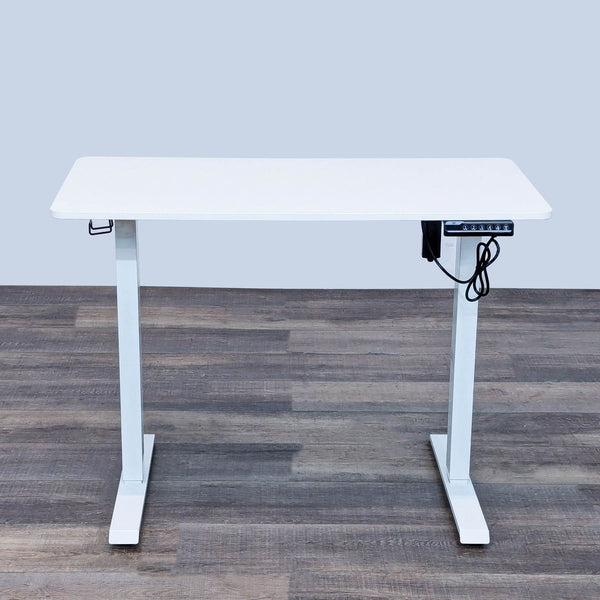Reperch adjustable height desk with cable management.