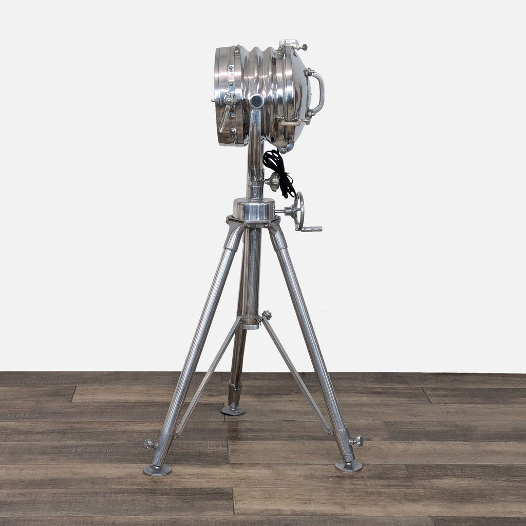 Nautical-style tripod lamp by Restoration Hardware, featuring an adjustable spotlight.