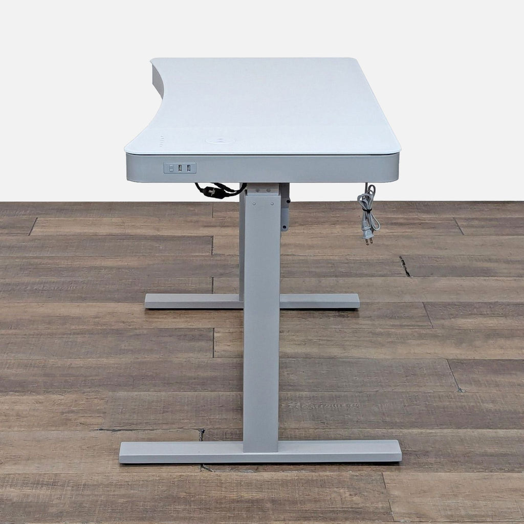 Standing desk with a pull-out drawer and ergonomic, water-resistant top.  