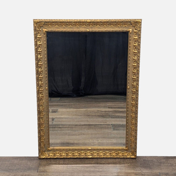 1. Ornate gold-framed mirror with intricate detailing, reflecting a wooden floor and dark backdrop.