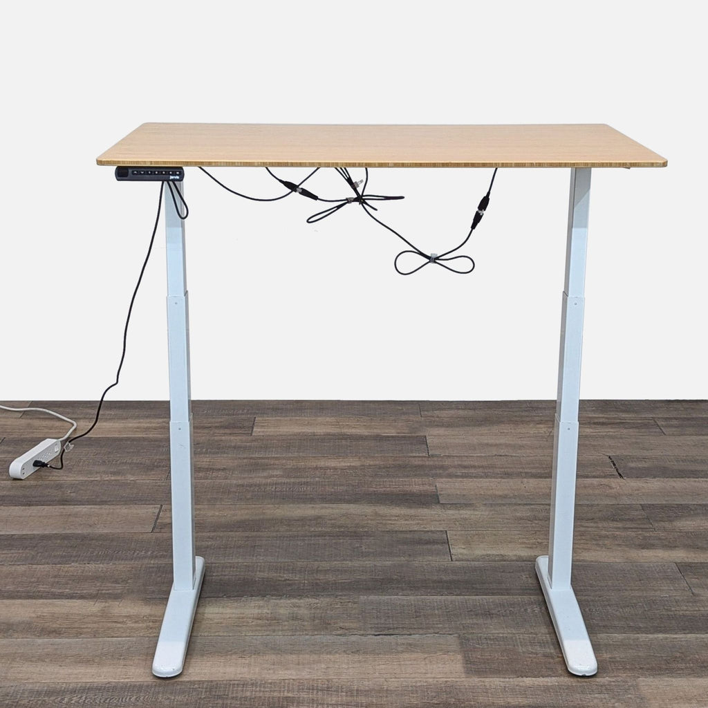 a wooden table with a wooden chair and a computer 