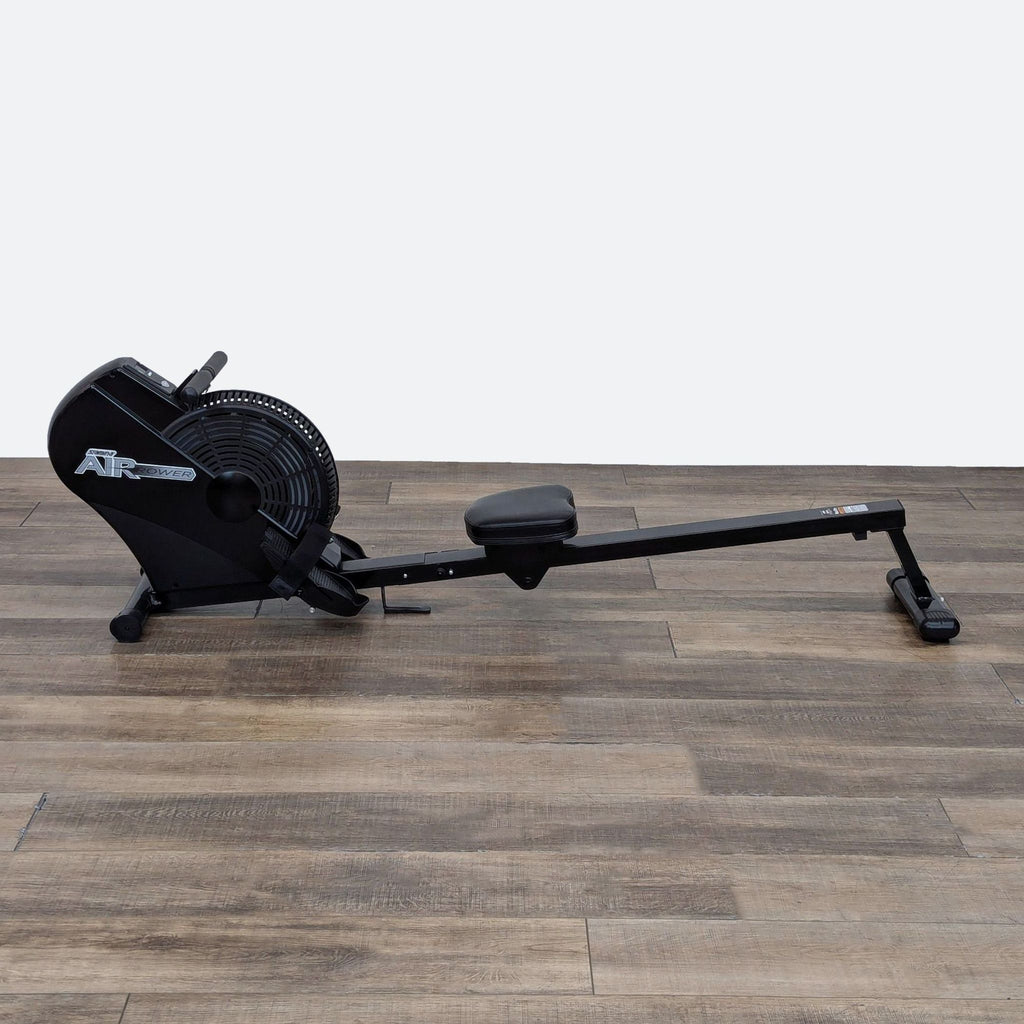 a black umbrella sitting on a floor 