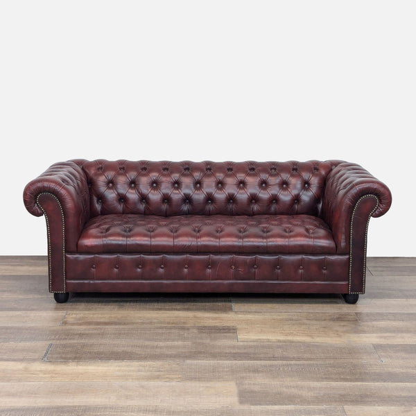 Red leather Chesterfield sofa with tufting and nailhead trim, 3-seat, Pendragon brand.
