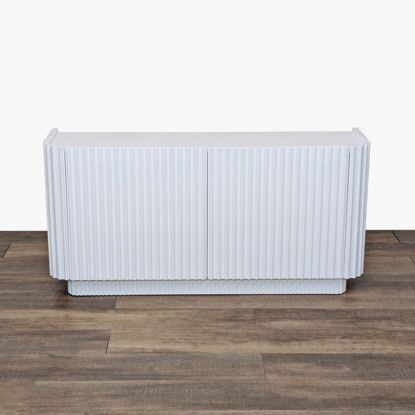 a white refrigerator sitting on top of a floor 