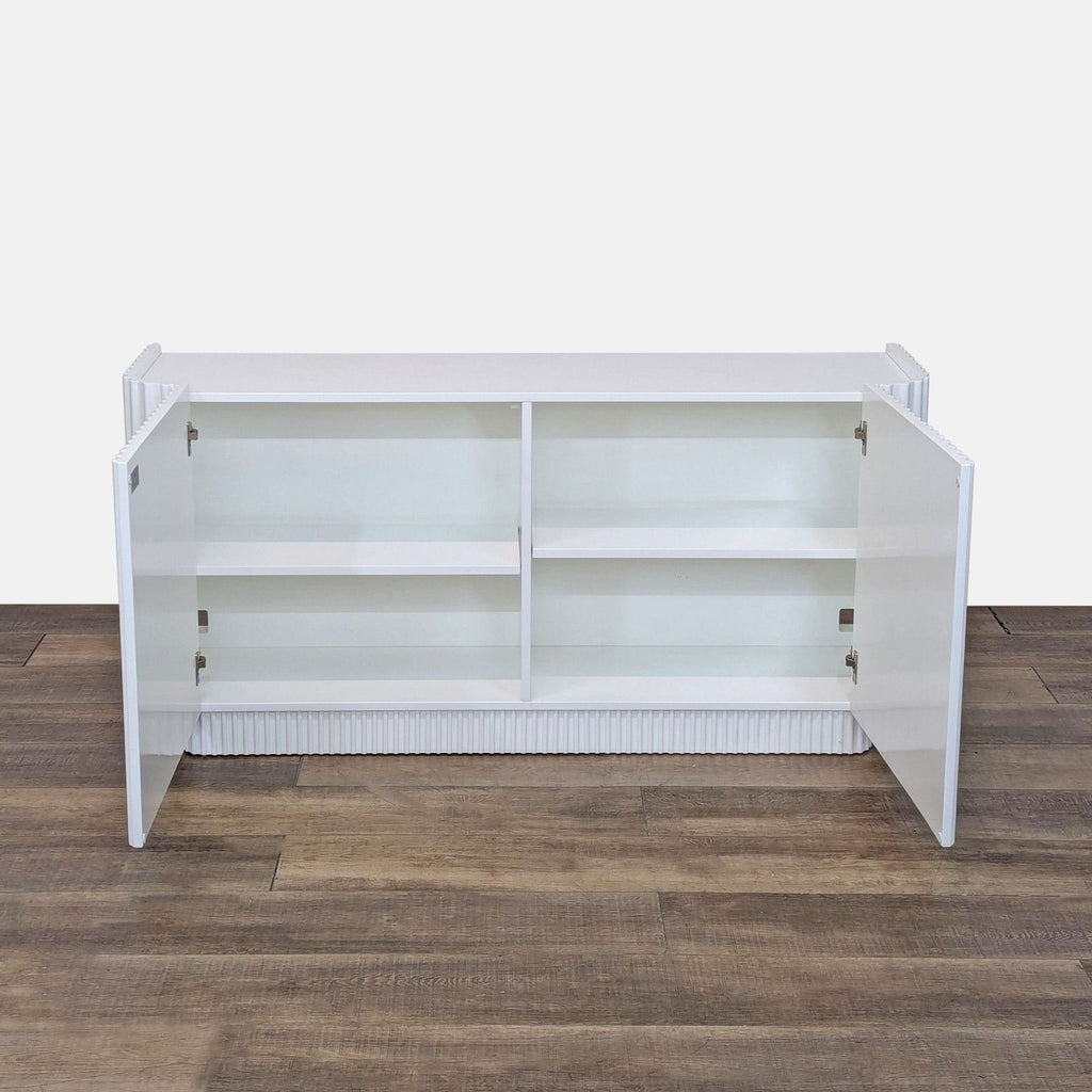 a white refrigerator sitting on top of a wooden floor 