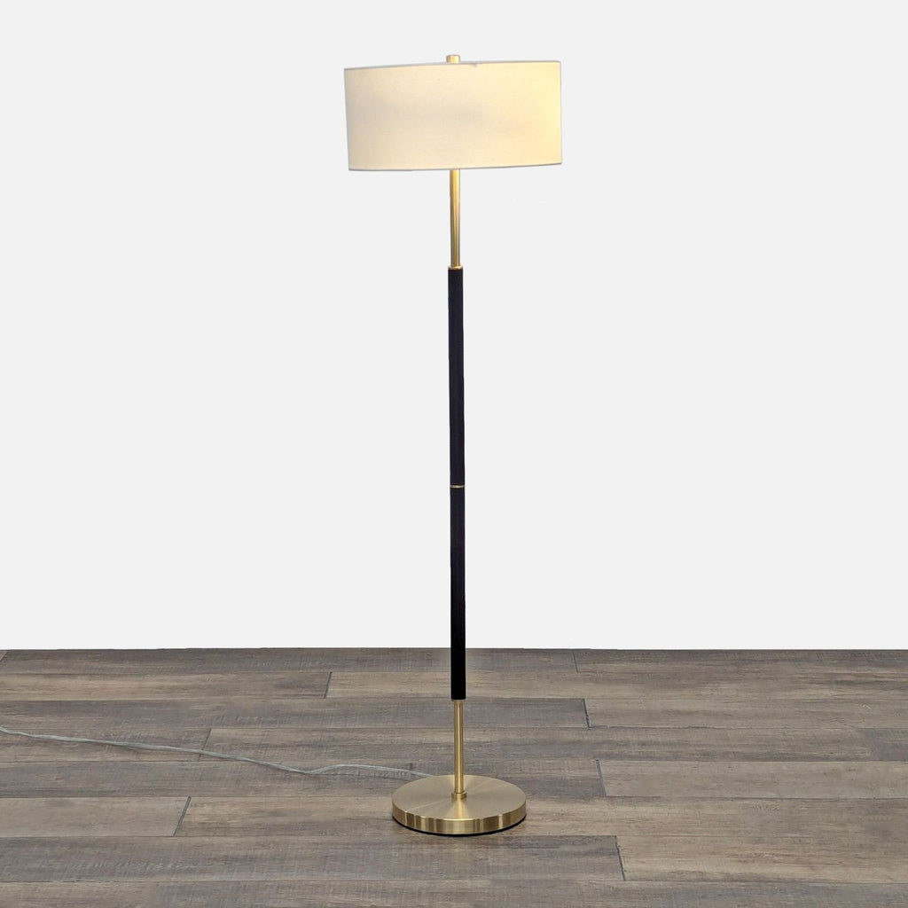 a lamp post with a white and black lamp 