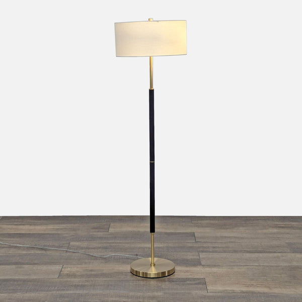a lamp post with a white and black lamp 