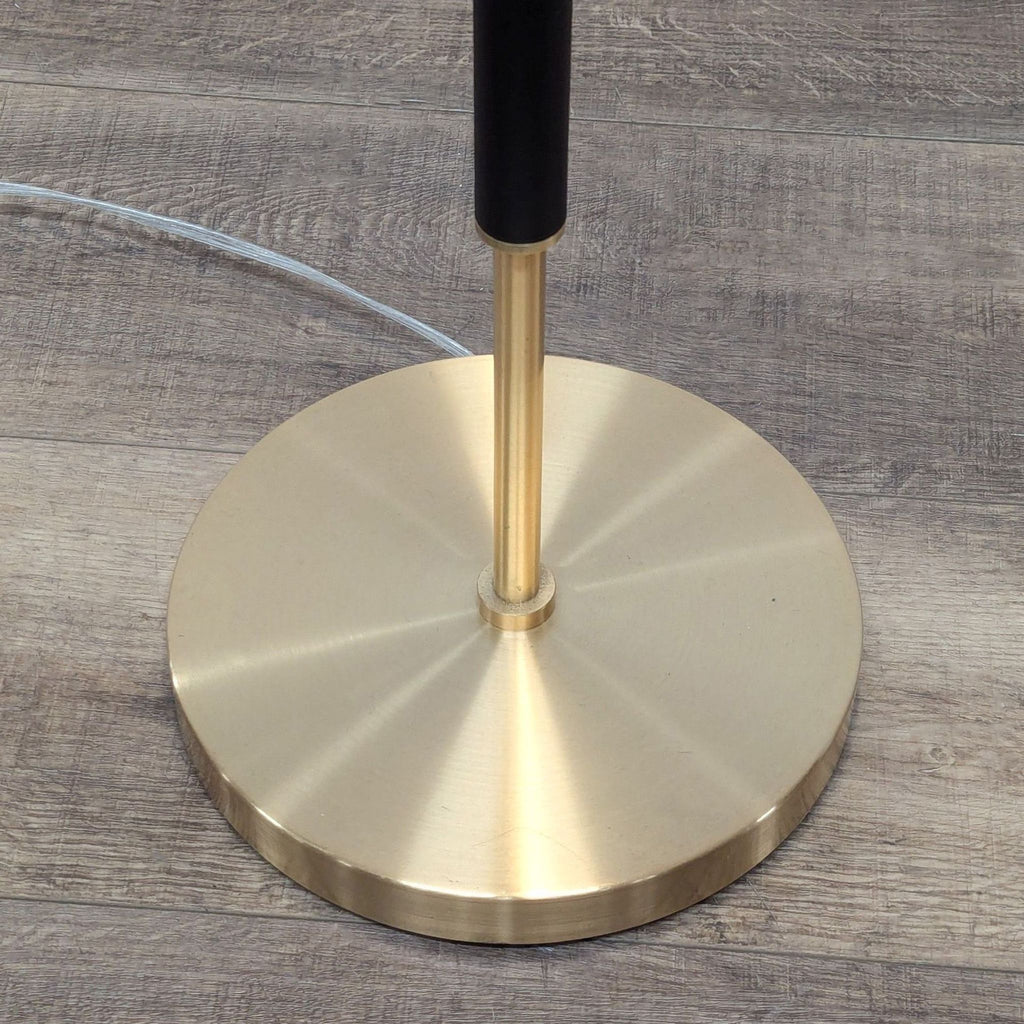 a metal object is on a wooden surface 