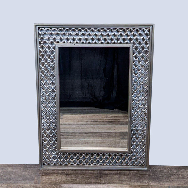 a mirror with a picture of a man in it 