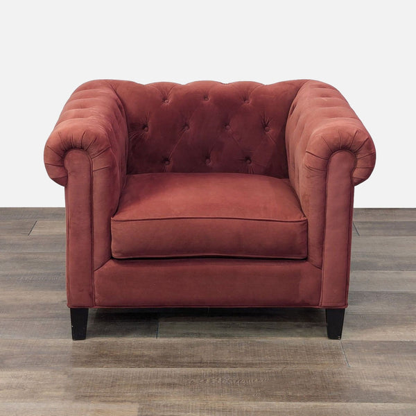 a black chair with a red handle 