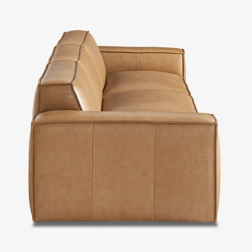 a couch with a brown leather seat and a black leather chair 