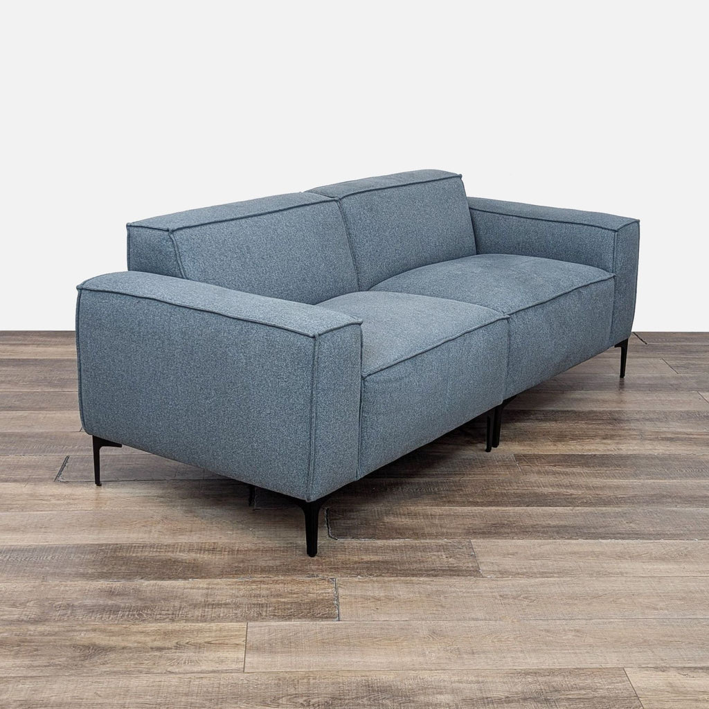 a couch with a black leather seat and a black leather couch 