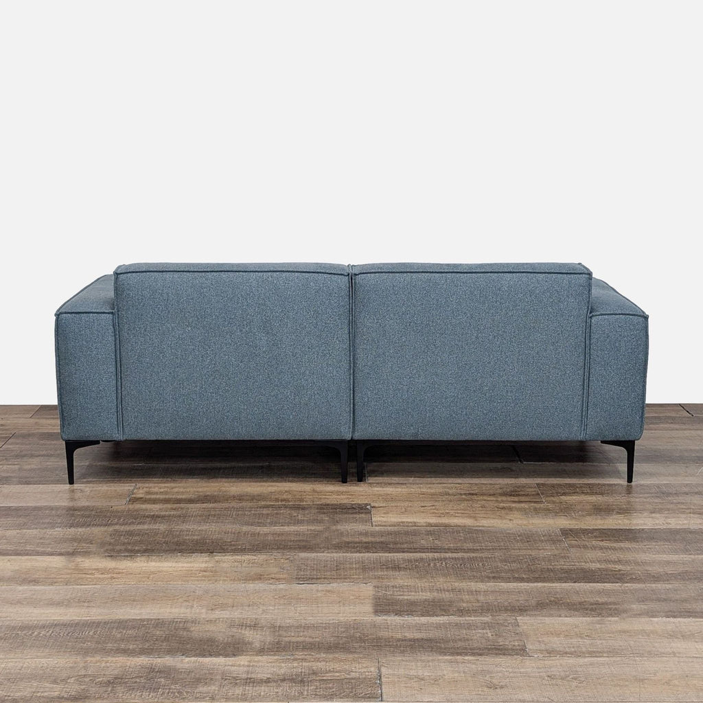 Modern Blue Sofa with Sleek Black Legs