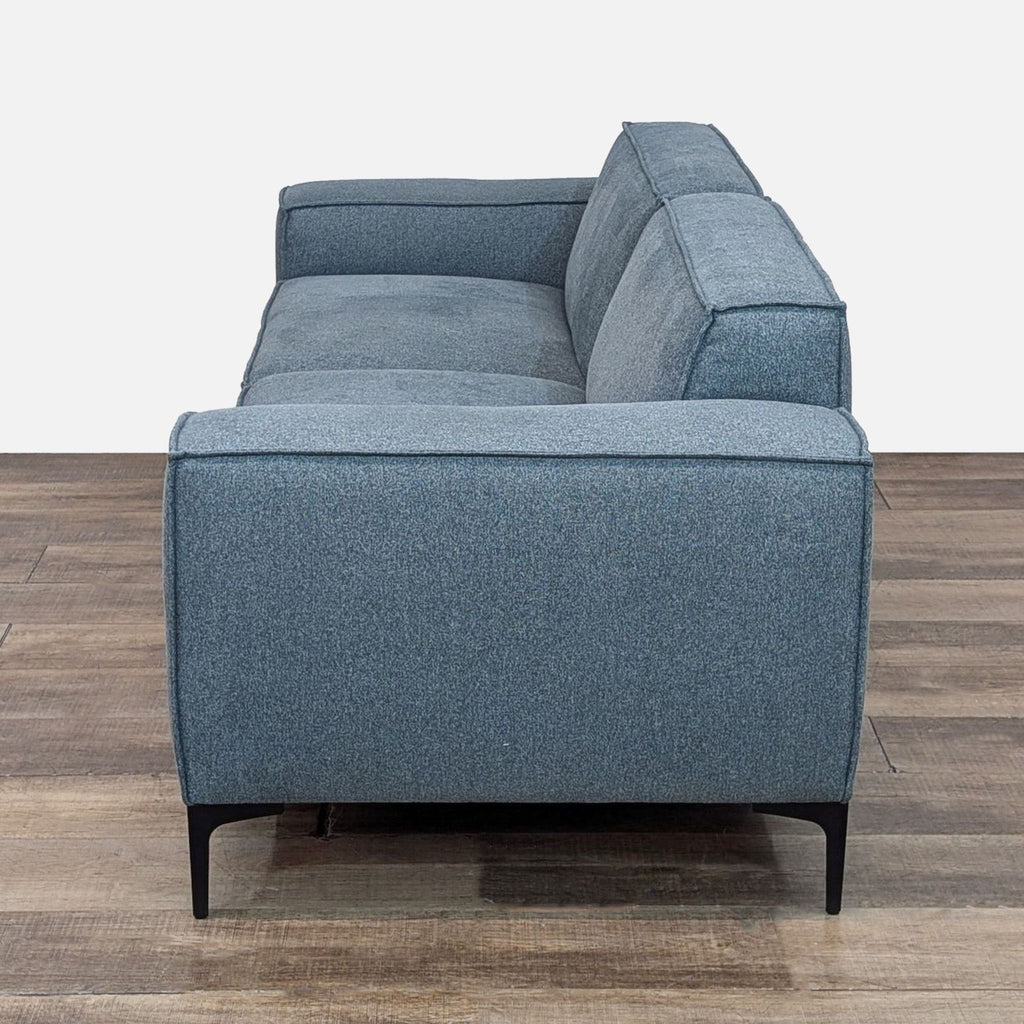 Modern Blue Sofa with Sleek Black Legs