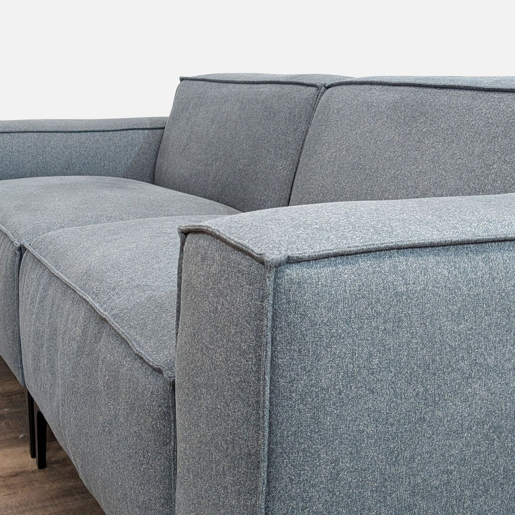 Modern Blue Sofa with Sleek Black Legs