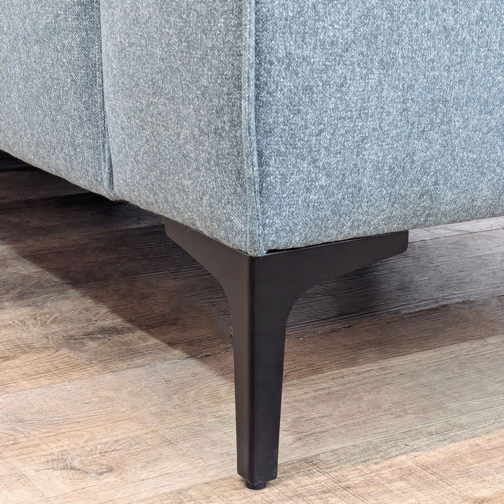 Modern Blue Sofa with Sleek Black Legs