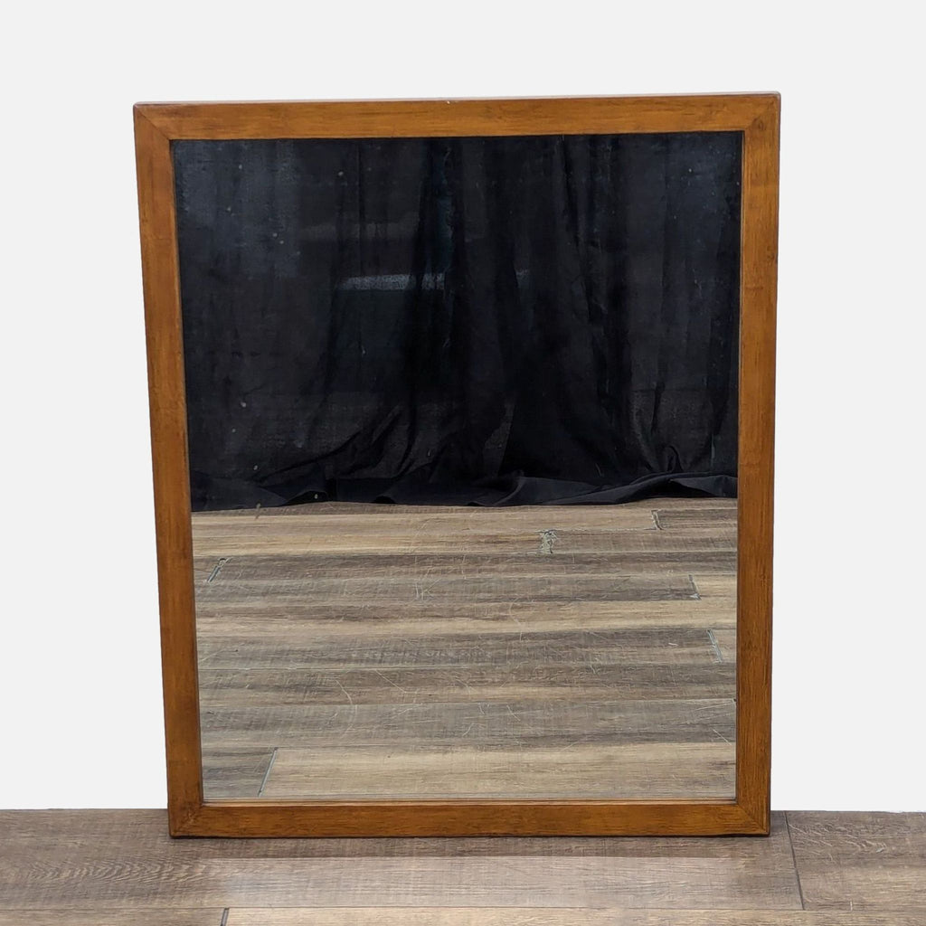 a wooden floor with a mirror and a wooden floor 