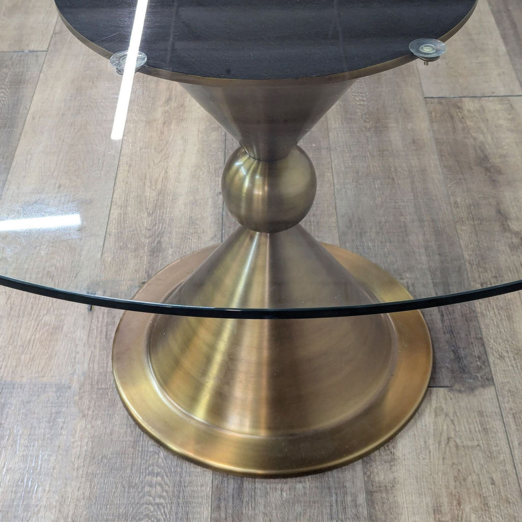 a glass table with a silver and black table top 