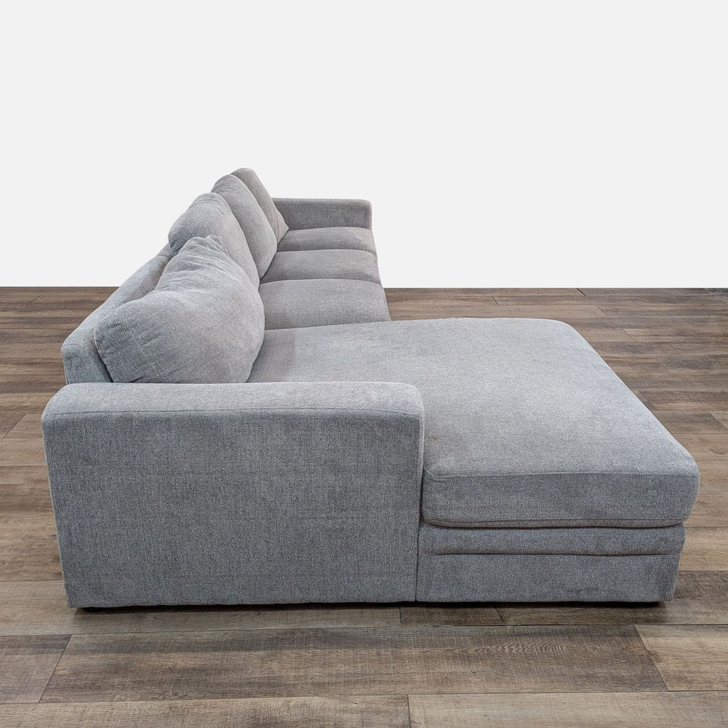 a couch with a black couch cushions and a black couch cushion 