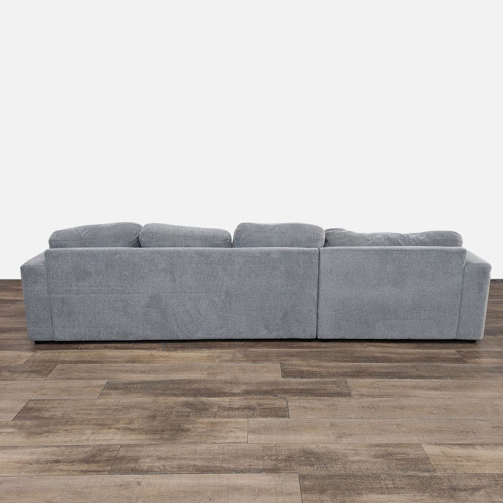 a couch with a black couch cushion on it 