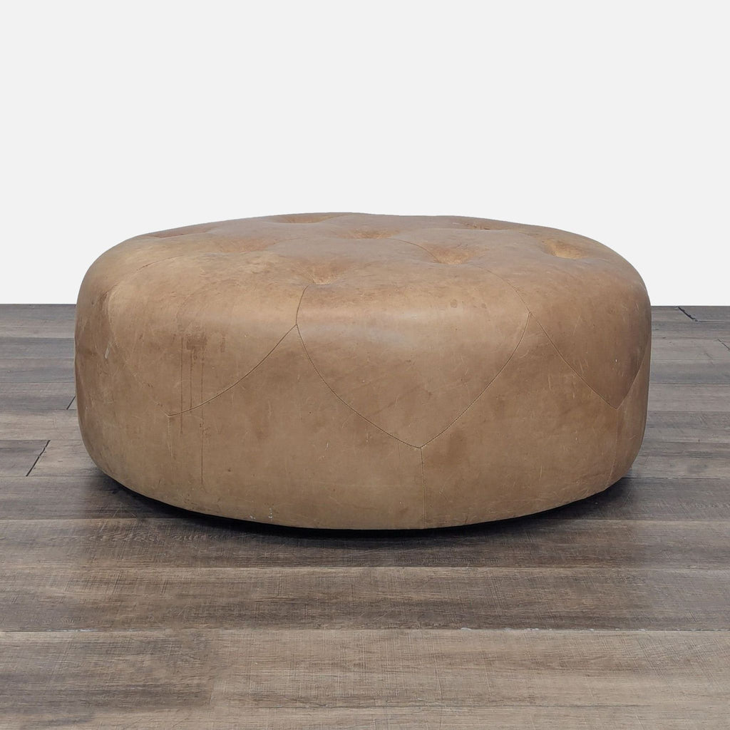 a black and white photo of a white leather sofa 