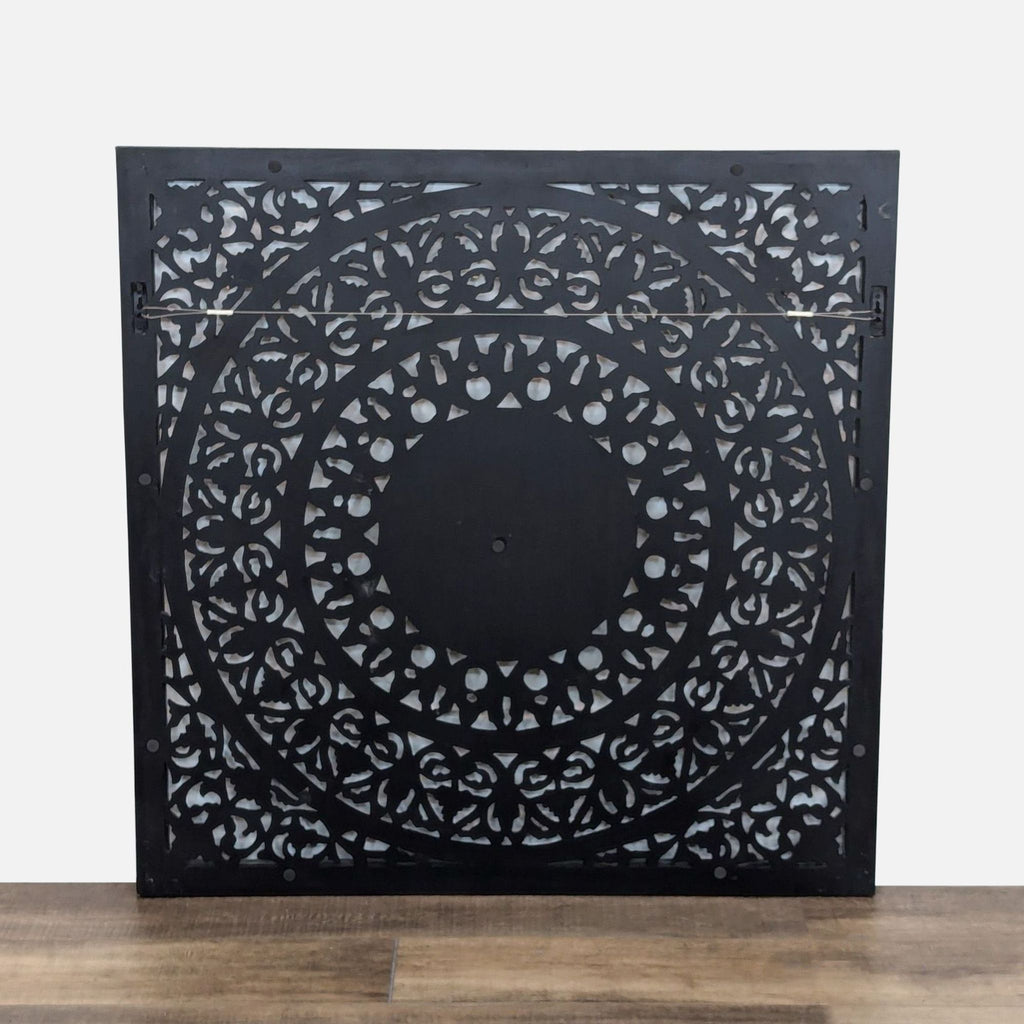 a wooden table with a vase with a picture of a bird on it 