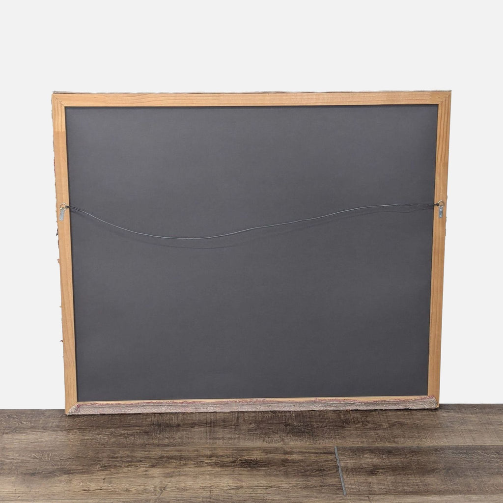 a wooden floor with a black and white rug 