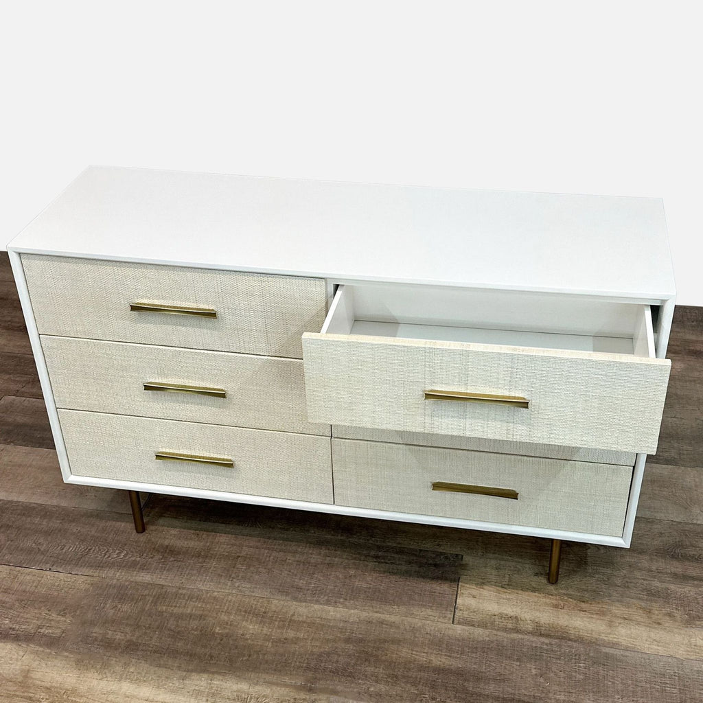 a white cabinet with a black and white striped cabinet 