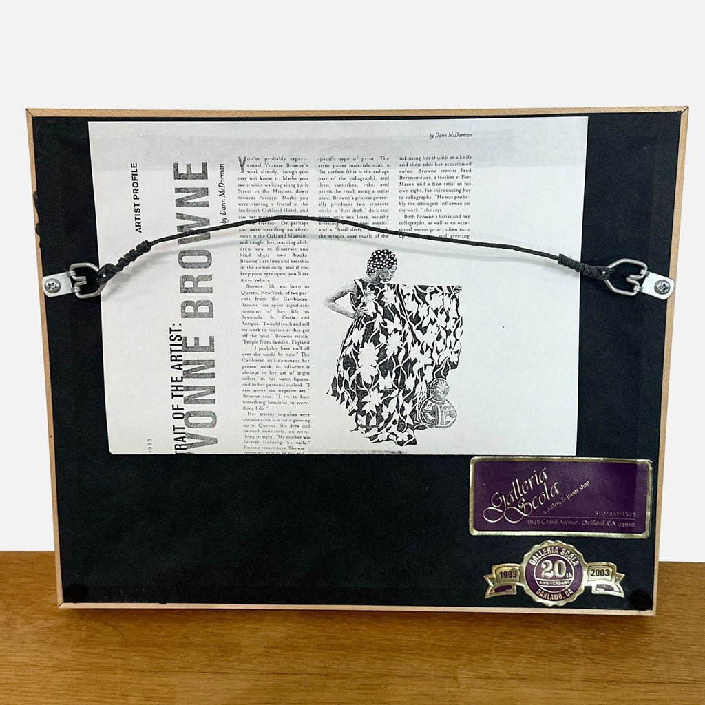 3. Back view of the frame with artist profile for Yvonne Browne and Galleria Scola gallery labels attached.