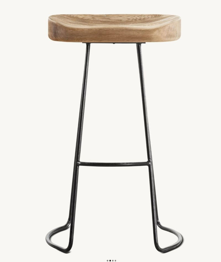 1. Modern Restoration Hardware stool with sculpted wood seat and metal sled base, perfect for contemporary interiors.