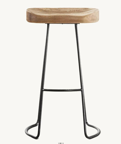 1. Modern Restoration Hardware stool with sculpted wood seat and metal sled base, perfect for contemporary interiors.