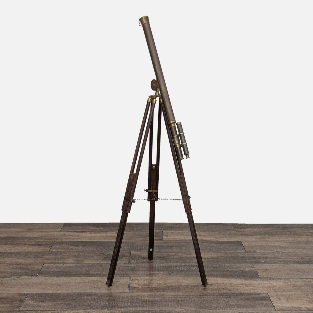 Side view of vintage brass telescope with adjustable wooden tripod.