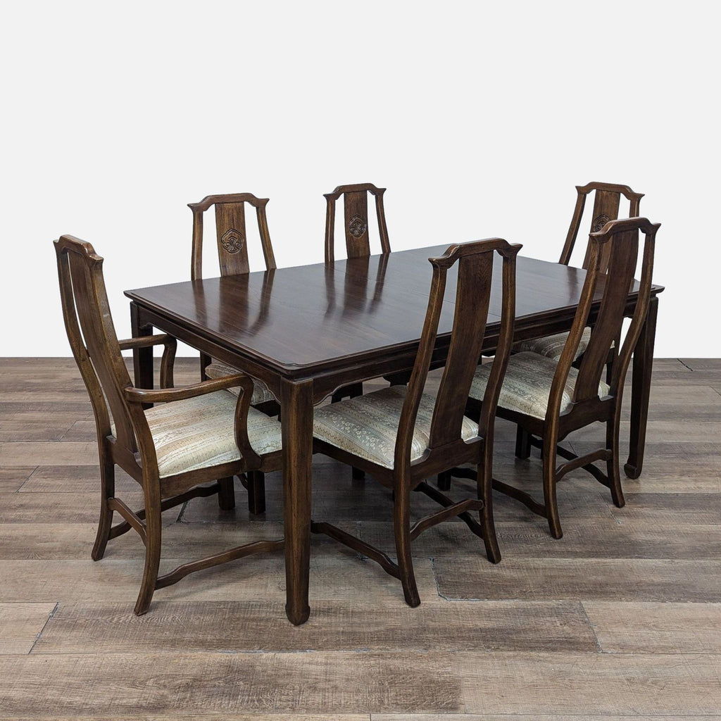 Reperch dining set with table, six side chairs, two arm chairs, upholstered seats on a wooden floor.
