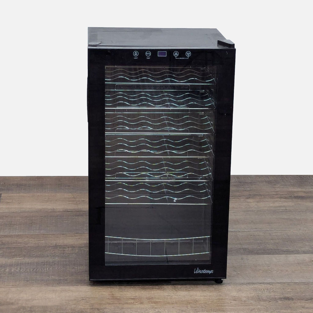 a white refrigerator with a black top 