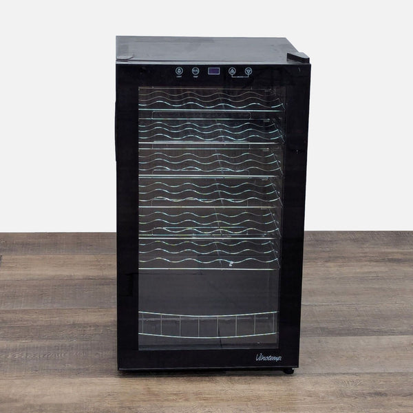 a white refrigerator with a black top 