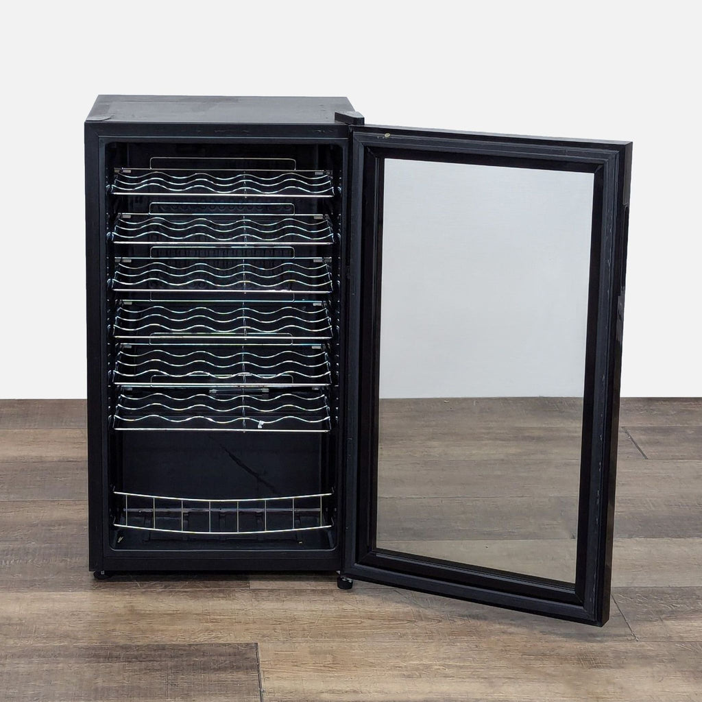 a white oven with a black door and a black cabinet 