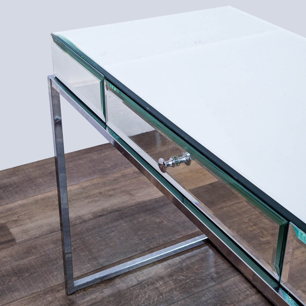 Modern Reperch desk featuring a drawer on metal glides, chrome frame, and mirrored sides.