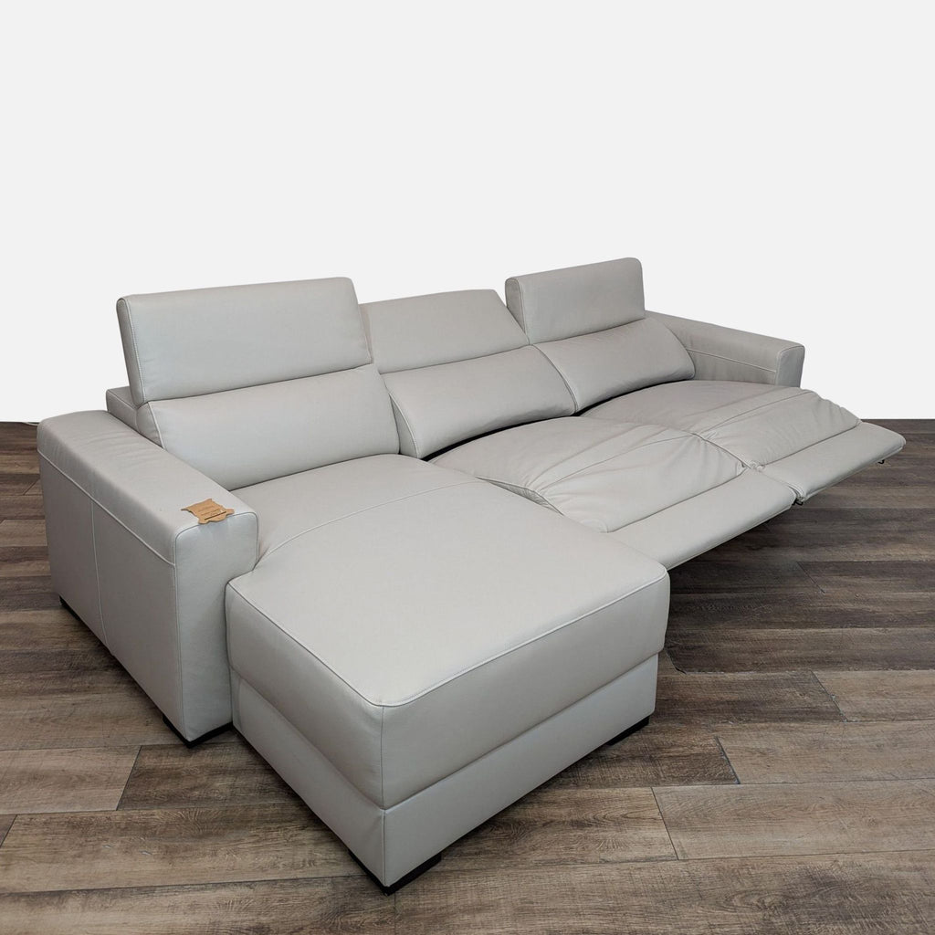 Adjustable headrests and spacious seating highlight this Argento Stone Ivory sectional from Reperch.