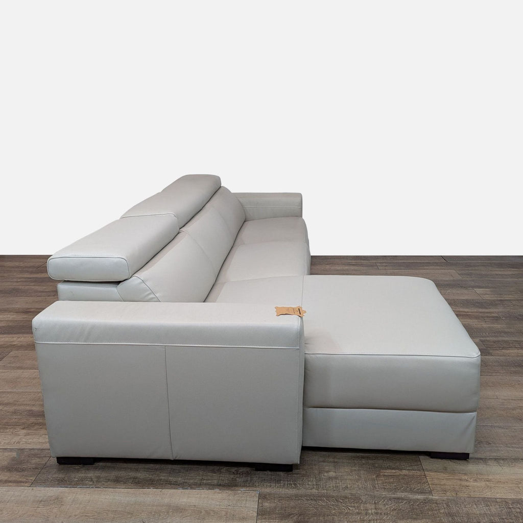 Macy’s Nevio Leather Reclining Sectional with Chaise and Articulating Headrests