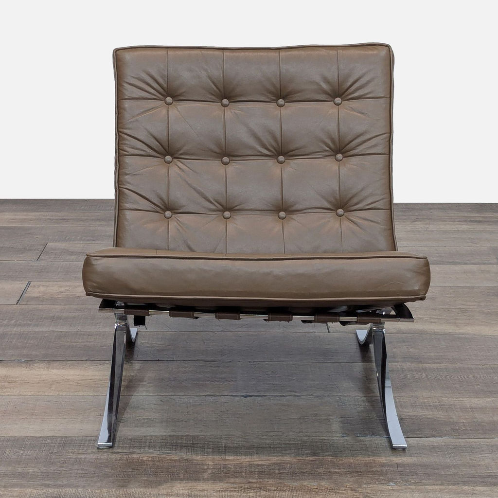 Replica Barcelona chair with a chrome base, leather straps, and tufted cushions.