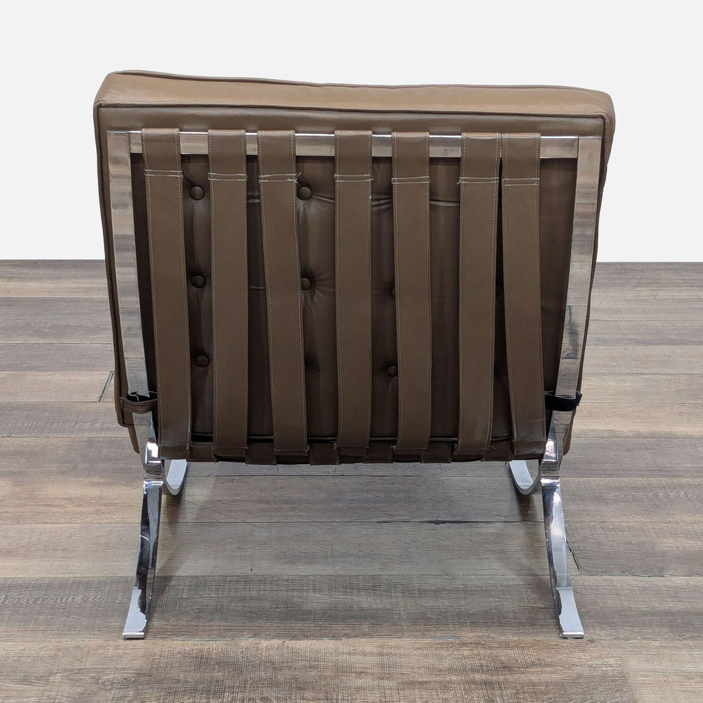 Back view of Reperch lounge chair showing leather straps and chrome detailing.