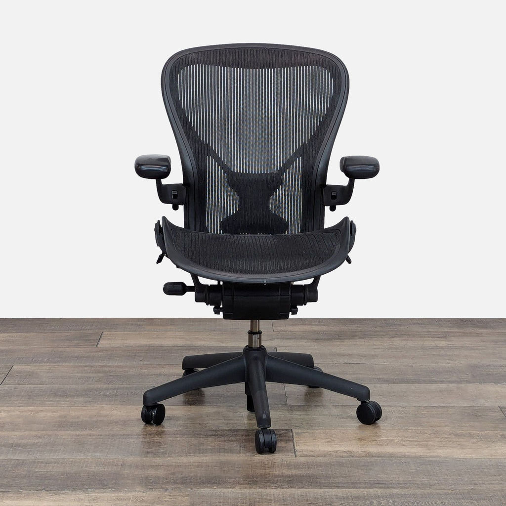 Front view of the Herman Miller Aeron Chair with adjustable features and breathable mesh back.