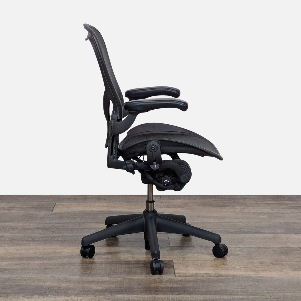 Side view of the Herman Miller Aeron Chair showing arm, seat, and recline adjustability.