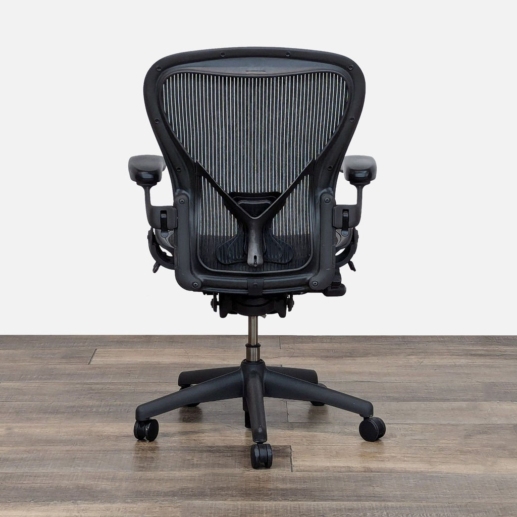 Back view of the Herman Miller Aeron Chair highlighting the ergonomic and breathable design.